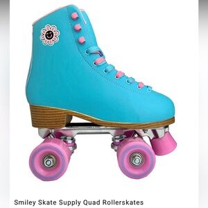 Smiley Skate Supply Quad Rollerskates